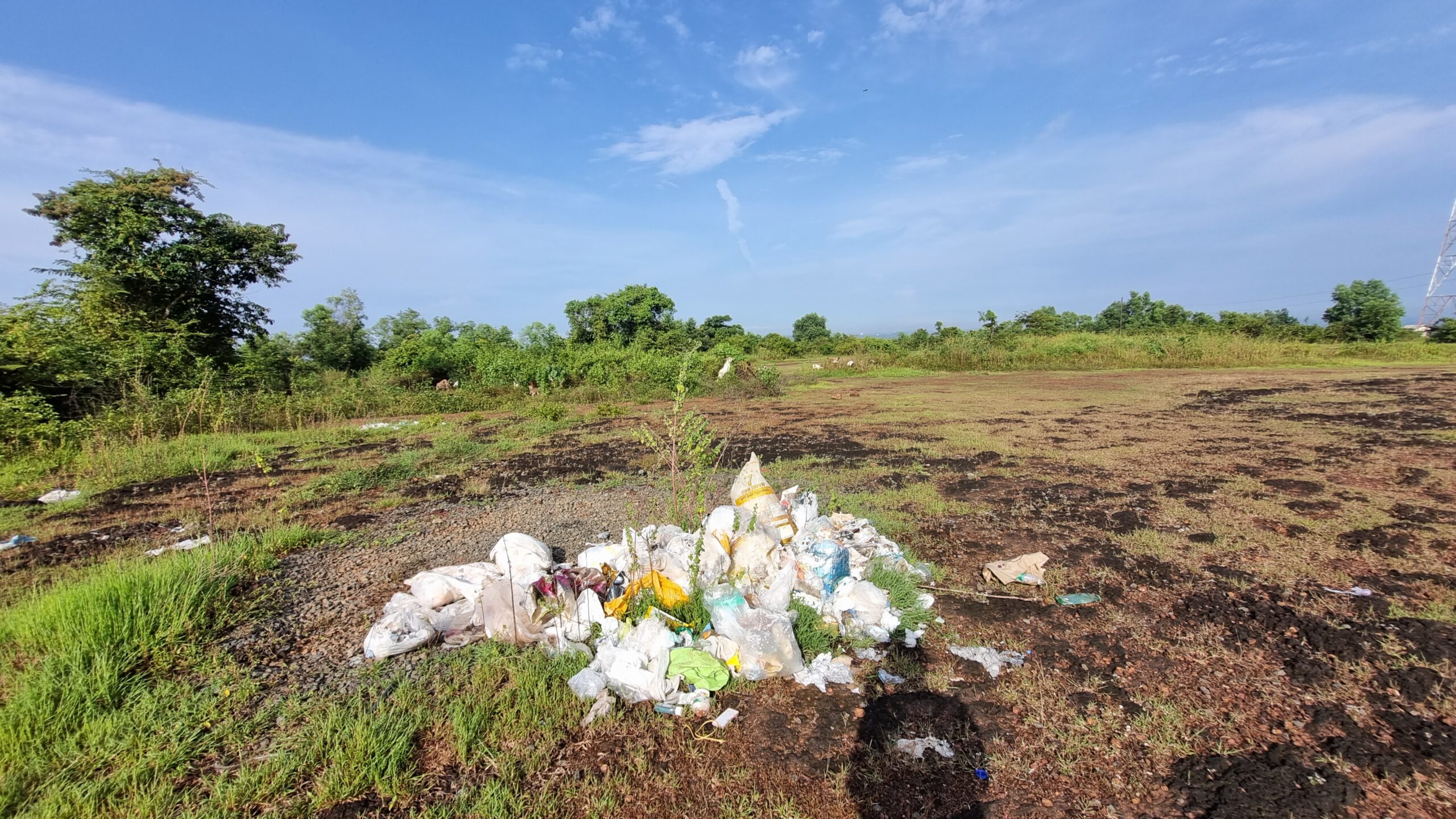 trach being dumped in a hill area